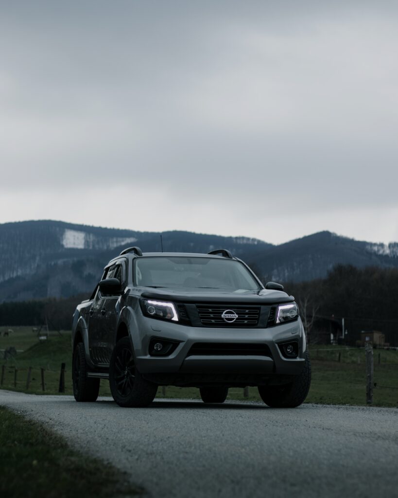 Gray Nissan Navara SUV in Scenic Rolling Hills - Adventure Background Wallpaper