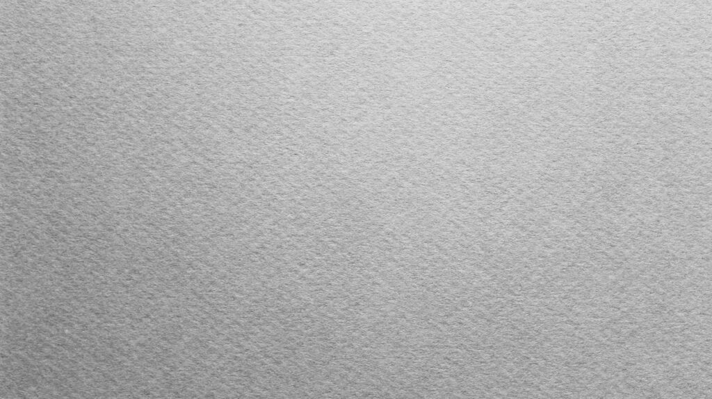High-resolution gray paper texture wallpaper with fine fibrous grain minimalist matte finish background