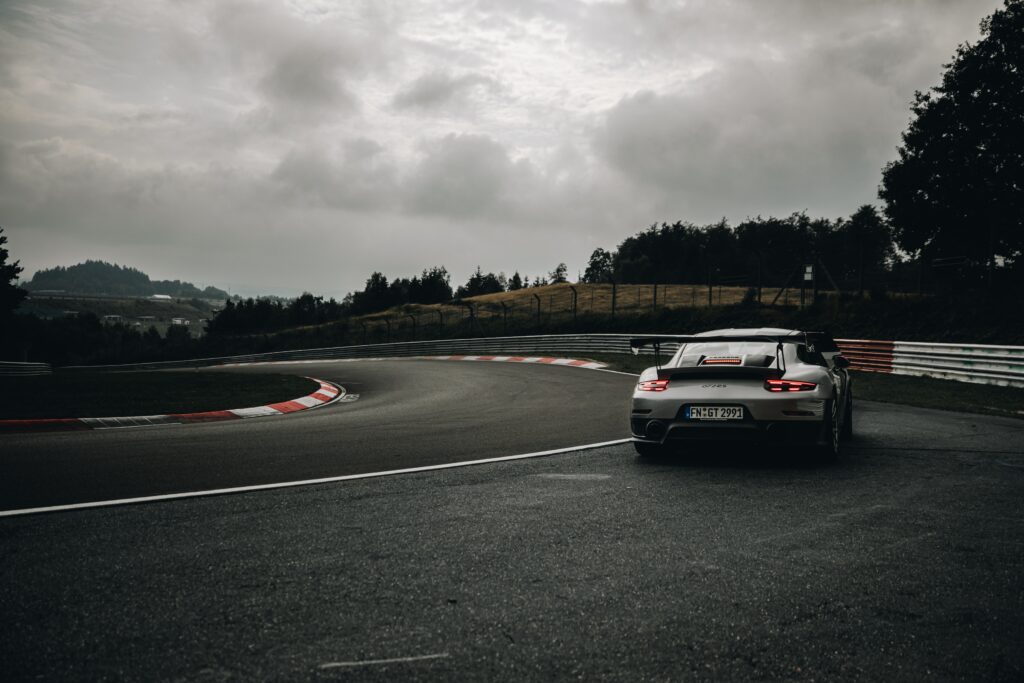 High-Speed Gray Porsche 911 GT2 RS Wallpaper - Rear View Racing