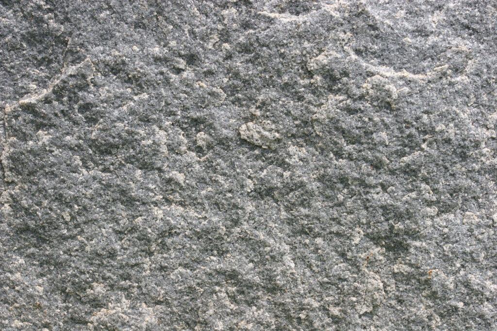 Close-Up Rock Texture: Gray Rough Surface & Natural Patterns Wallpaper