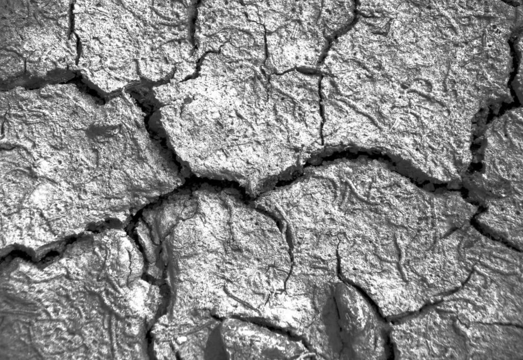 Gray Textured Wallpaper: Cracked Rugged Surface for Natural Aesthetic