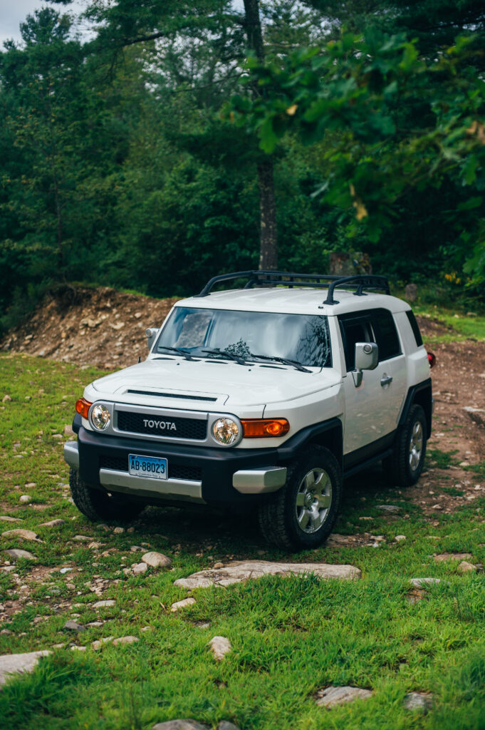 Gray Toyota FJ Cruiser SUV in Lush Forest Adventure Wallpaper