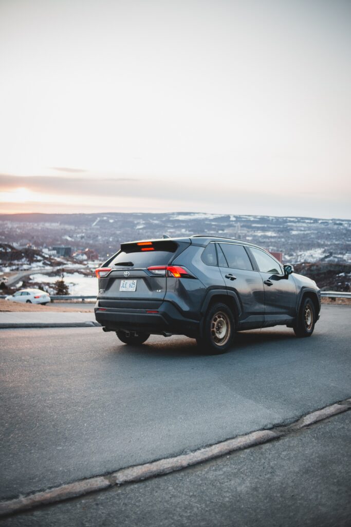 Gray Toyota RAV4 SUV on Scenic Road - Sleek Modern Wallpaper