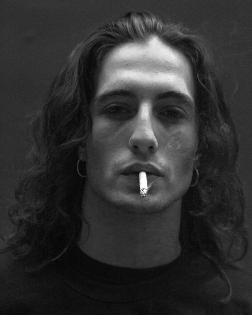 Grayscale Wallpaper of Damiano David: Bold, Intense & Rebellious