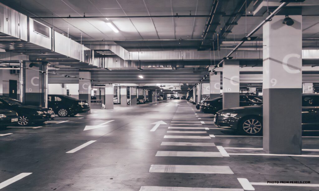 Grayscale Wallpaper: Spacious Underground Parking Lot Design