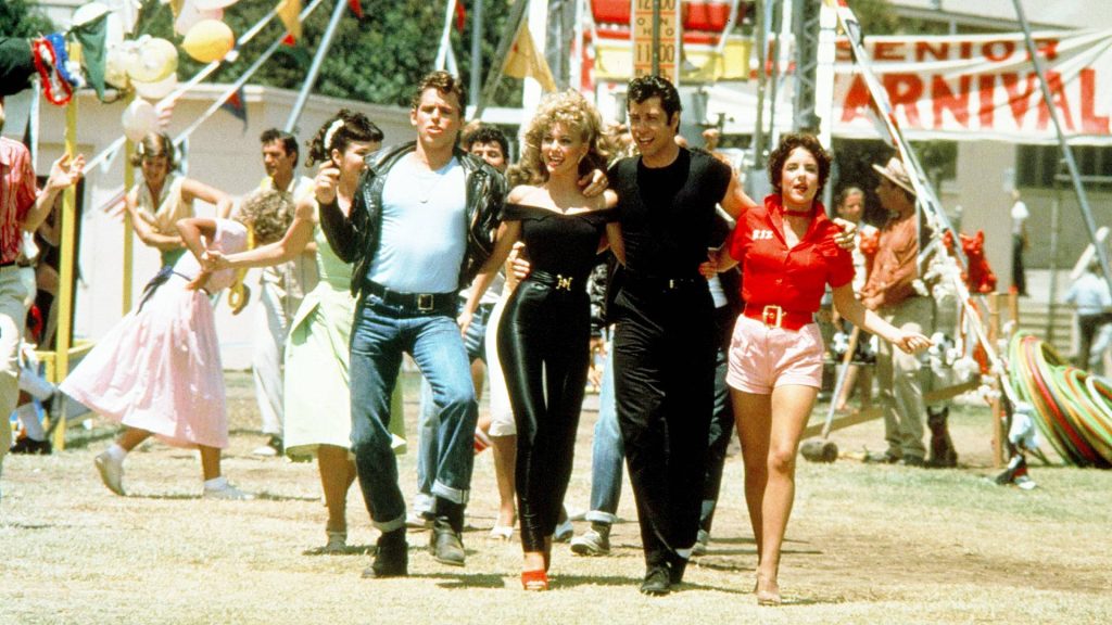Grease wallpaper iconic 1950s Danny Sandy Kenickie Rizzo Senior Carnival vibrant musical scene