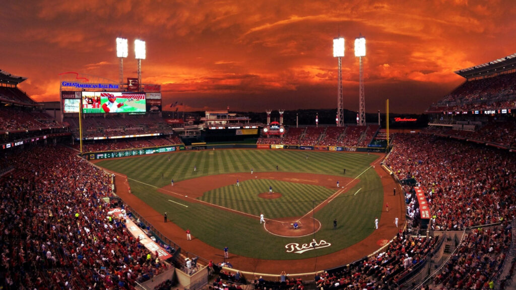 Great American Ball Park sunset with glowing sky red orange Reds game stadium lights panoramic Wallpaper