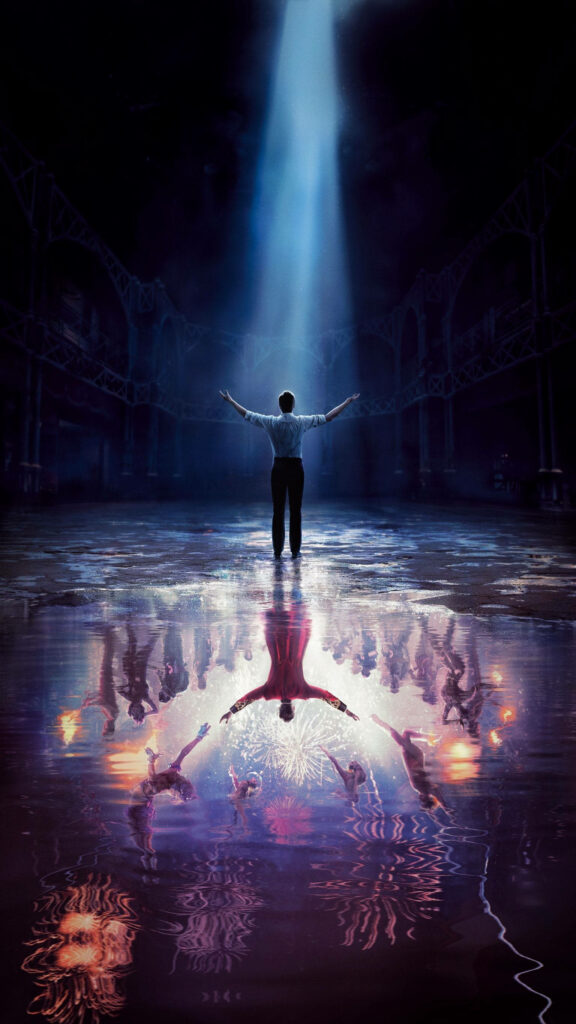 The Greatest Showman inspired wallpaper with spotlighted performer and vibrant circus reflection