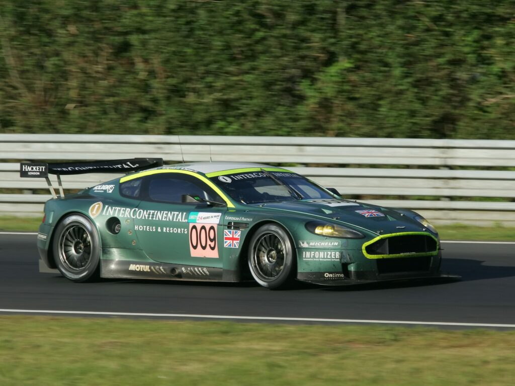 Green Aston Martin DBR9 Racing Car Wallpaper - Dynamic Side View