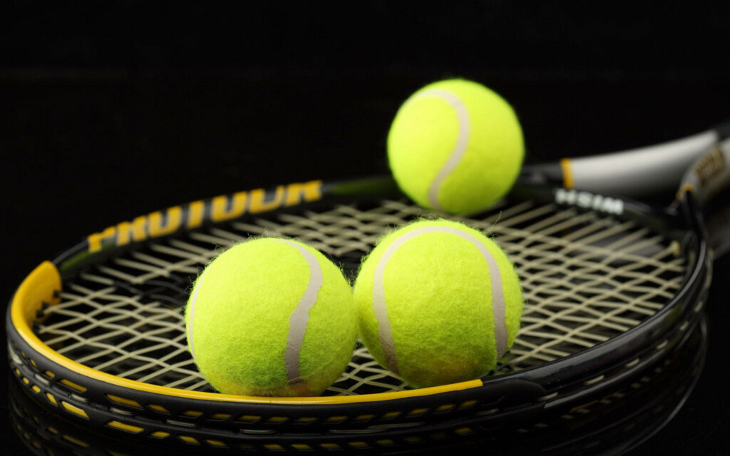 Greener Pastures: A Stunning Badminton Racket Sports Wallpaper