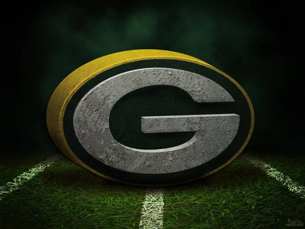 Green Bay Packers logo 3D metallic texture on grassy football field with moody lighting background Wallpaper