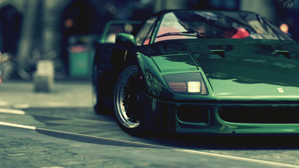 Roaring Power: A Captivating Snapshot of the Iconic Ferrari F40 in Motion Wallpaper