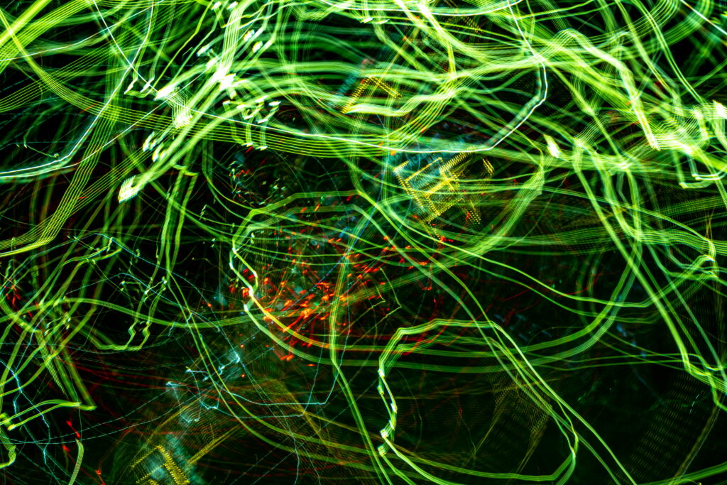 Luminous Green Abstraction: Mesmerizing Neon Lines Illuminate a 5K Wallpaper Background