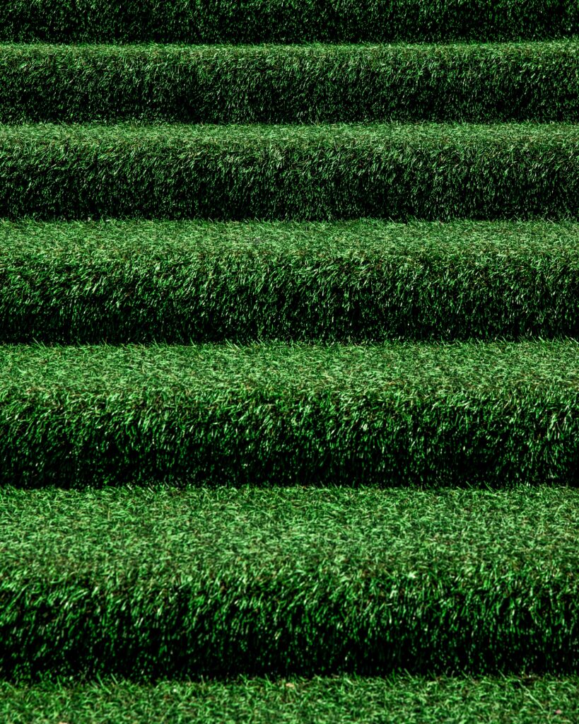 Close-up of green grass stairs texture vibrant natural fresh outdoor minimalistic wallpaper background
