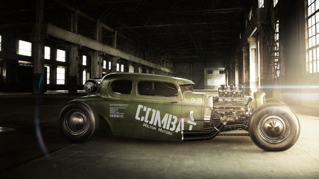 Green hot rod muscle car with exposed engine in industrial warehouse dramatic sunlight wallpaper