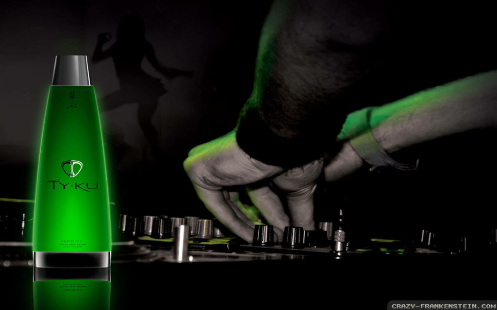 Green Glow Grooves: Male DJ Fine-Tunes Mixer in Electrifying Wallpaper