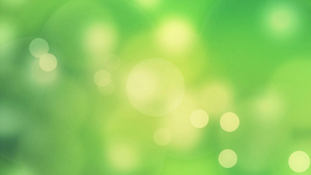 Green Glow: A Breathtaking Bokeh Wallpaper in Shades of Light Green