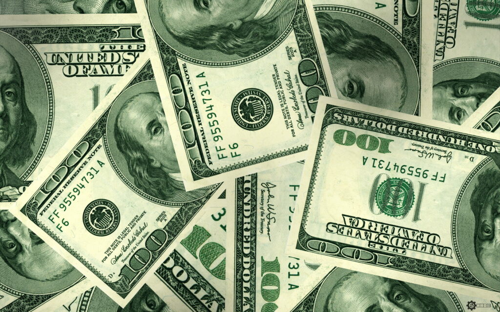 The Wealth-Infused Green Canvas: A High-Definition Wallpaper of $100 American Dollar Bills
