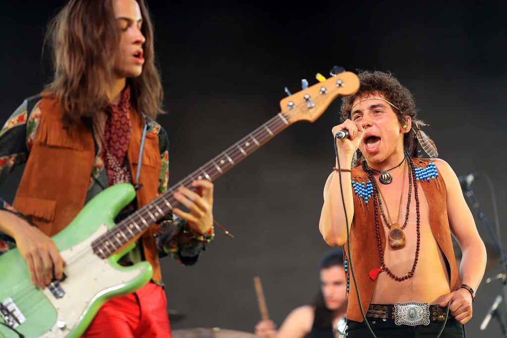 Greta Van Fleet live rock concert with Josh Kiszka singing and Sam Kiszka playing bass Wallpaper