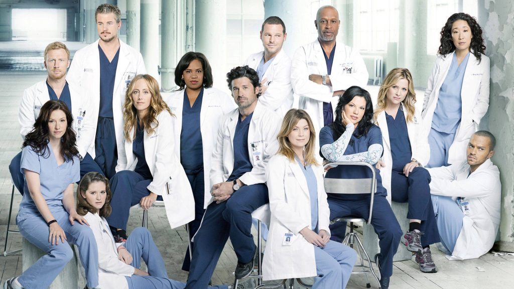 Grey's Anatomy wallpaper featuring Meredith Grey and Derek Shepherd in bright clinical setting