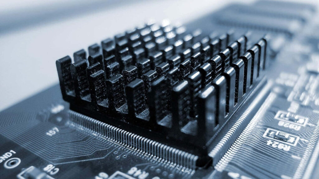 Intricate Greyscale Circuit Board & Heat Sink Wallpaper Background