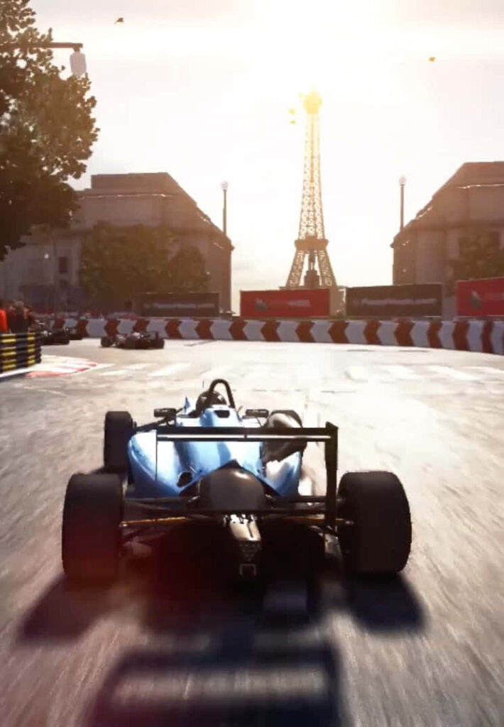 Racing through Paris: An Epic Open Wheel Car Battle at the Iconic Eiffel Tower Wallpaper