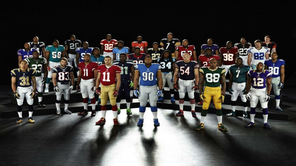 NFL Stars Strike a Bold Pose Against Sleek Black Backdrop - Captivating NFL Background Image Wallpaper in HD 1600x900 Resolution
