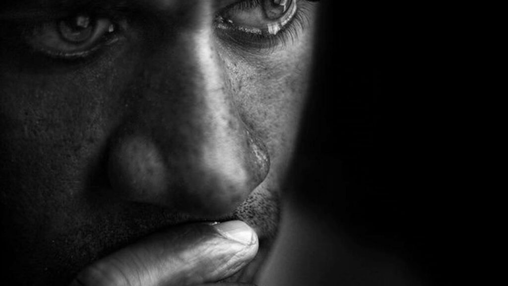 Tearful Solitude: A Melancholic Portrait in Monochrome Wallpaper