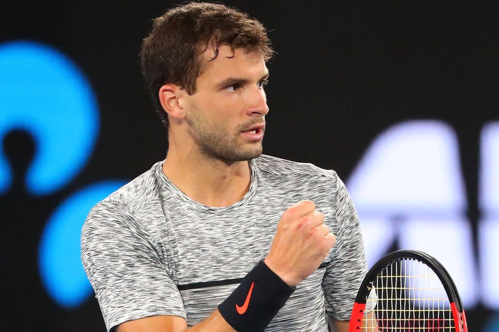Grigor Dimitrov intense close-up tennis portrait with clenched fist grey shirt Nike wristband wallpaper