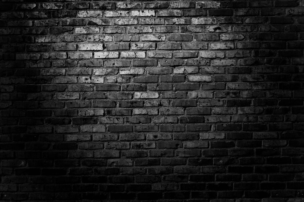 Grisly Cool: Intricate Patterns Transcending Black Brick Wall's Texture - Captivating QHD Wallpaper Background Photo