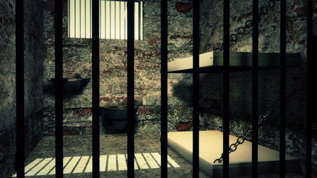 Gritty prison cell wallpaper with weathered brick walls and light through barred windows background