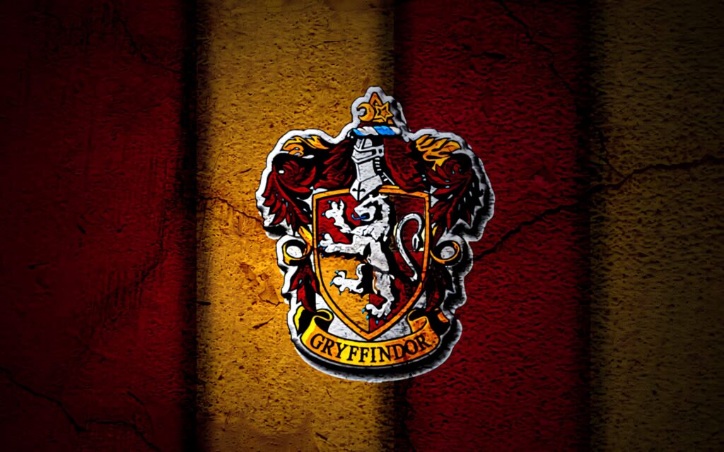 Bold Gryffindor crest on textured red and gold striped background Hogwarts house spirit wallpaper