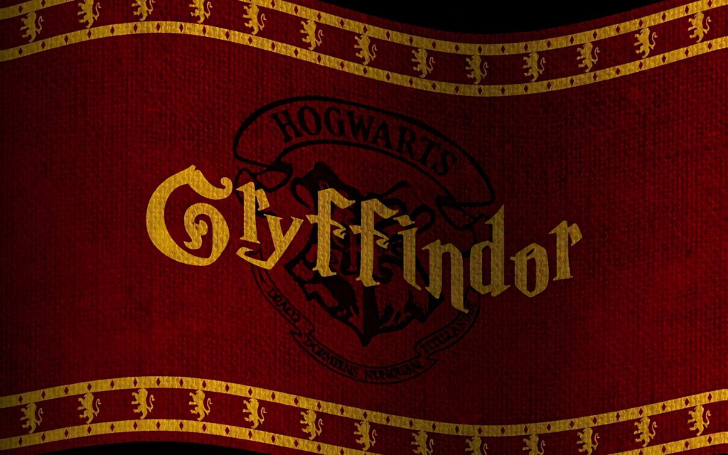 Gryffindor House crest banner with golden lettering red background Hogwarts emblem lion wallpaper