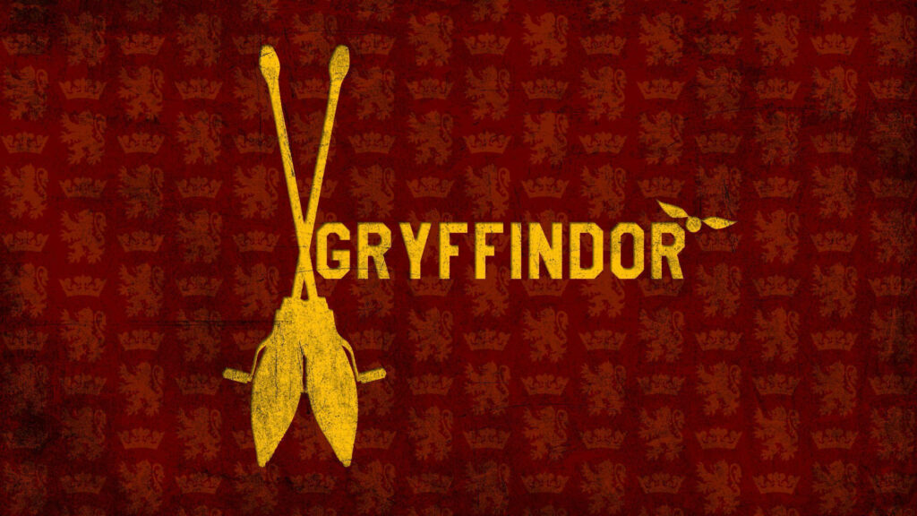 Gryffindor House crest gold on red background with broomsticks and lion motifs Harry Potter wallpaper
