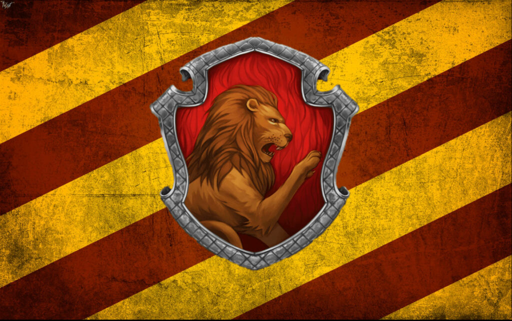 Gryffindor House crest wallpaper with bold lion emblem red and gold stripes background