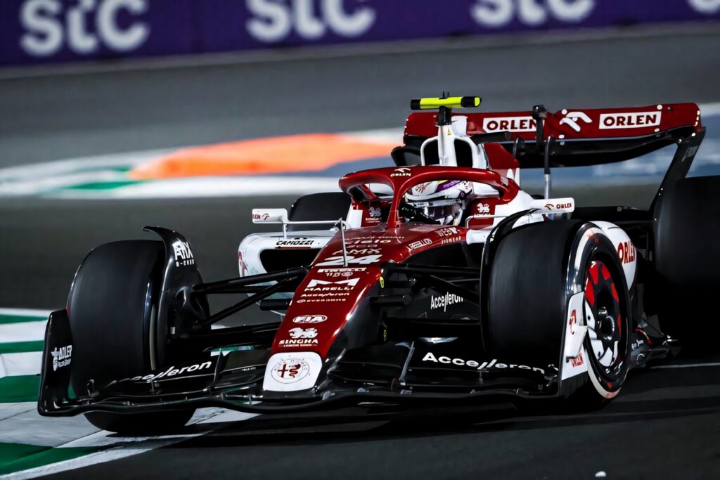 Guanyu Zhou racing Formula 1 car at Jeddah street circuit fast speed precision wallpaper