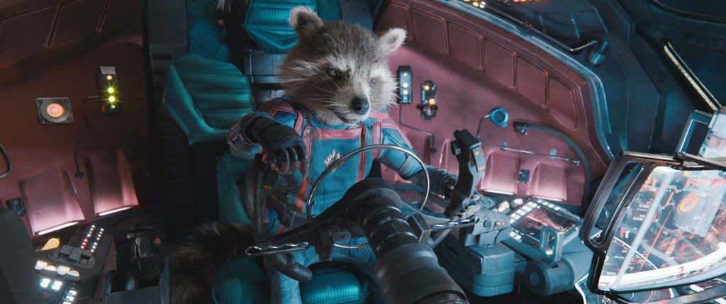 Rocket Raccoon pilots Guardians of the Galaxy Vol 3 sci-fi cockpit with teal and red lighting Wallpaper