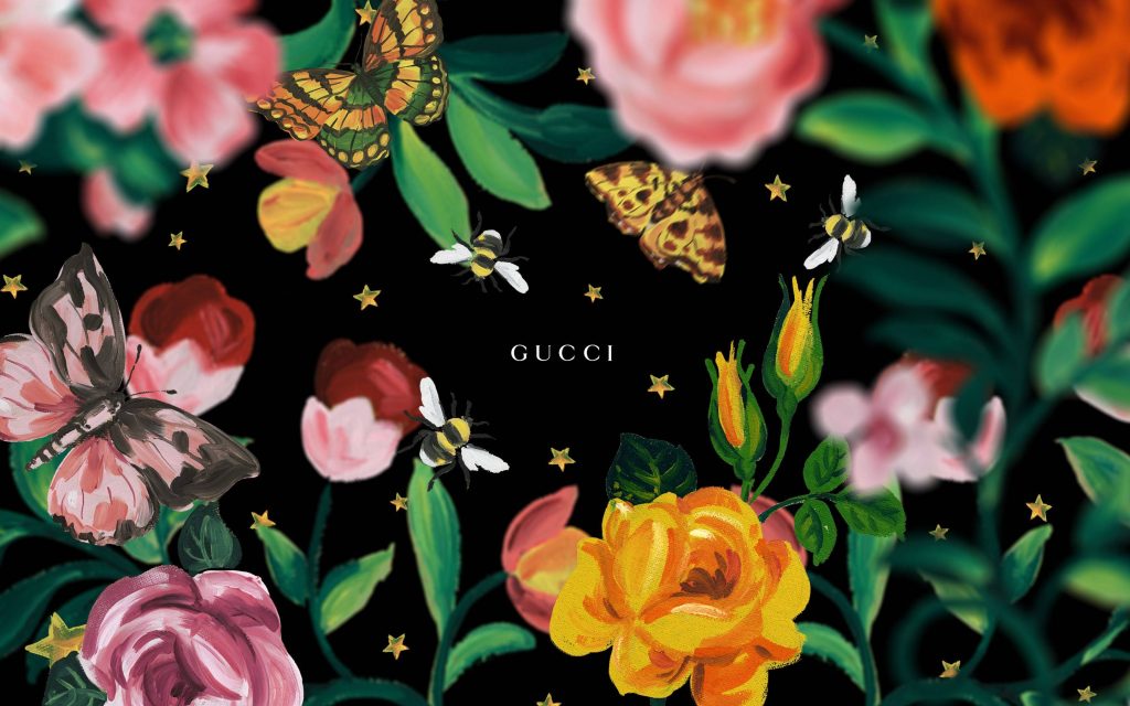Gucci wallpaper with vibrant roses butterflies bees gold stars on black luxury botanical design
