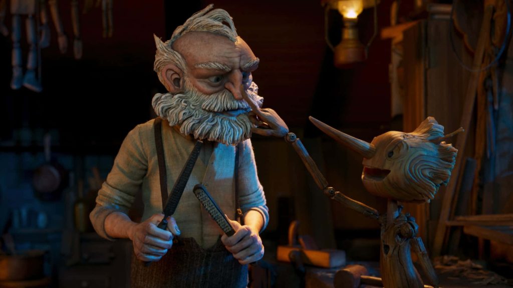 Guillermo del Toro Pinocchio Geppetto and puppet in warm rustic stop motion workshop wallpaper