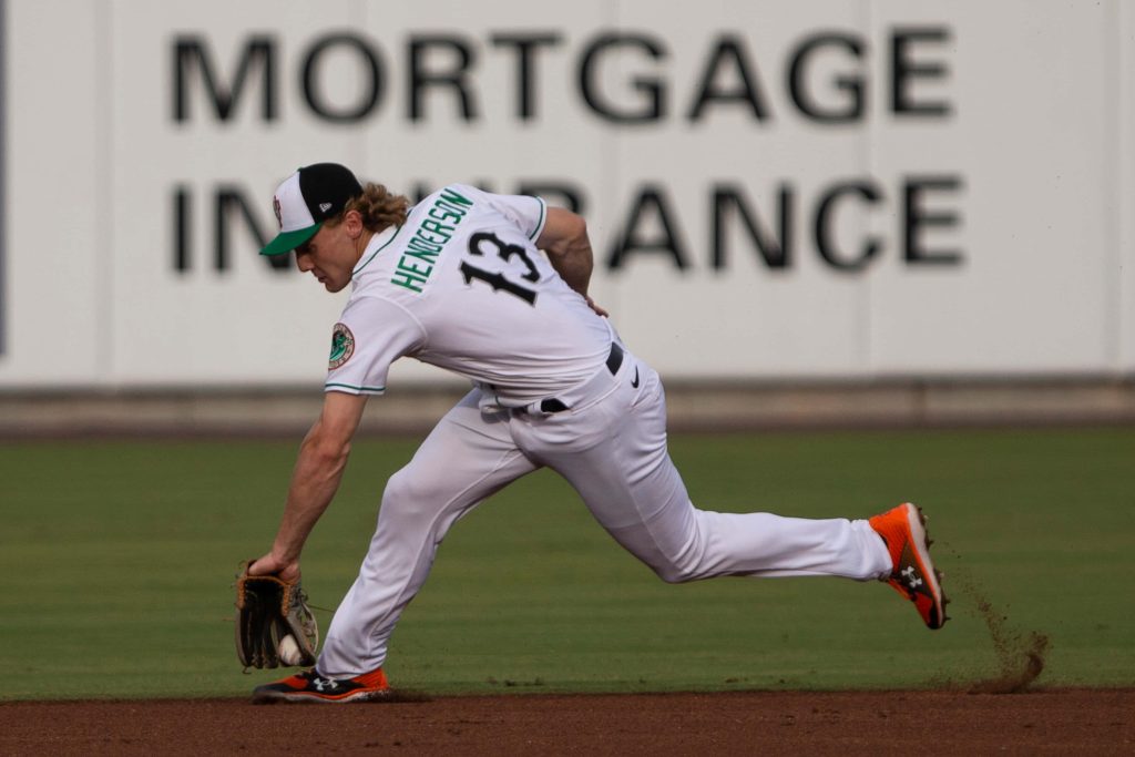 Baltimore Orioles Gunnar Henderson lunging to field ground ball MLB infield action wallpaper