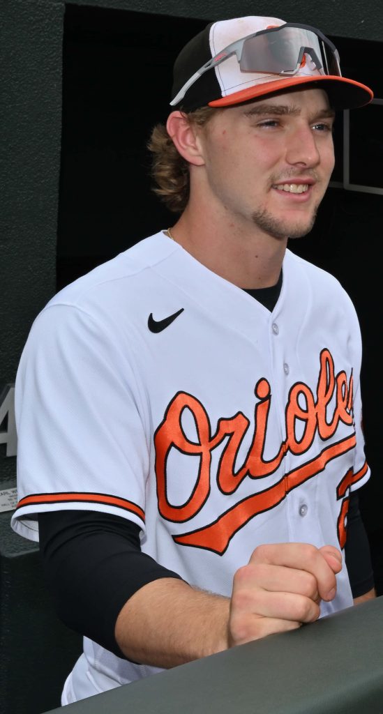 Baltimore Orioles shortstop Gunnar Henderson smiling in white jersey and team cap MLB wallpaper