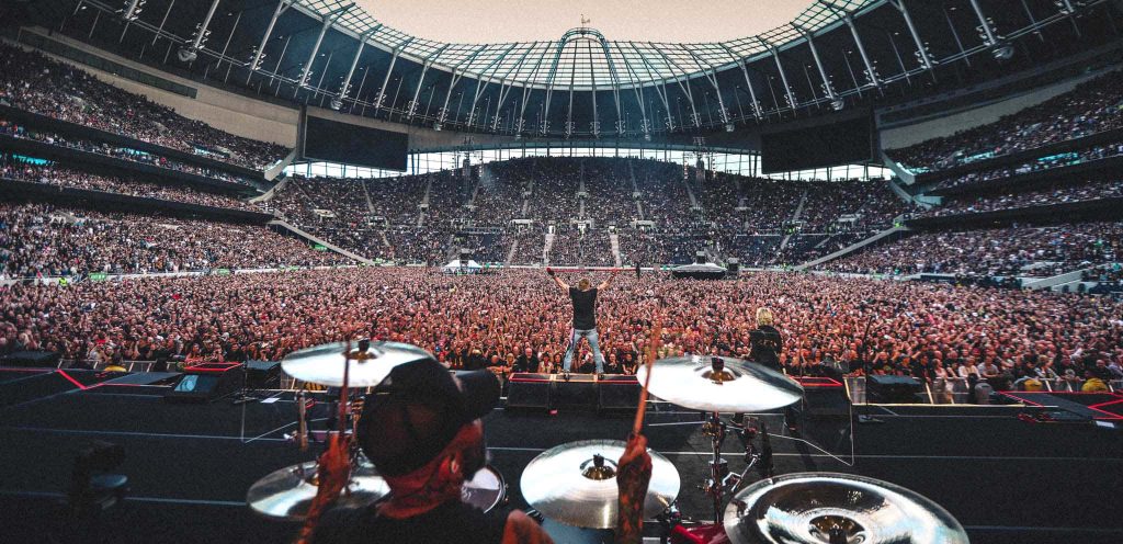 Guns N Roses live concert view from drummer vibrant crowd Tottenham Hotspur Stadium lights Wallpaper