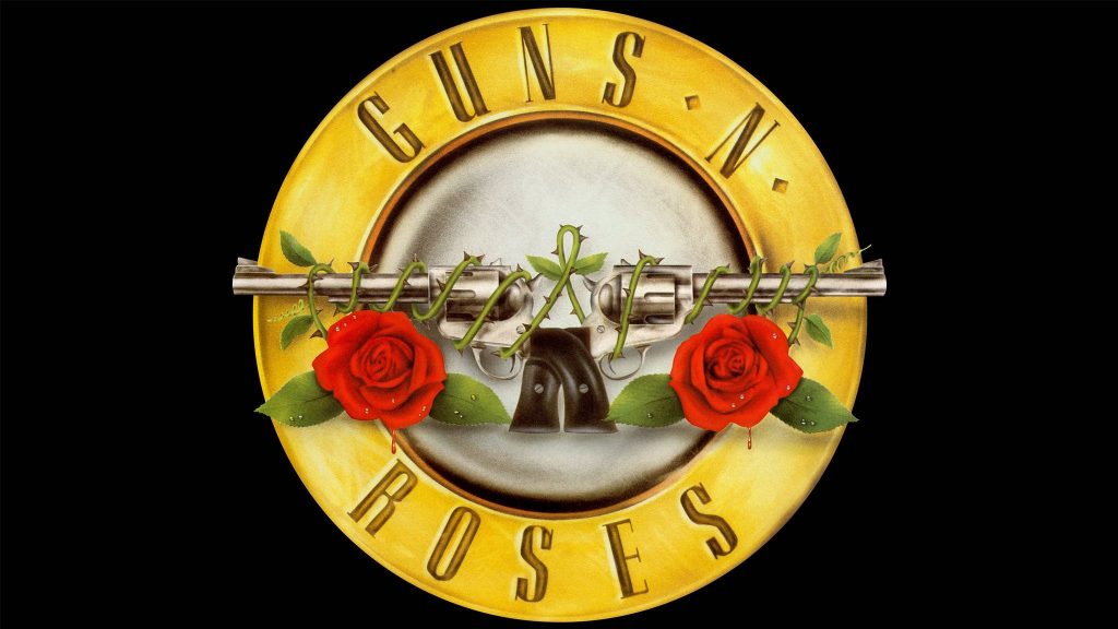 Guns N Roses emblem with crossed revolvers and red roses on yellow circle black wallpaper background