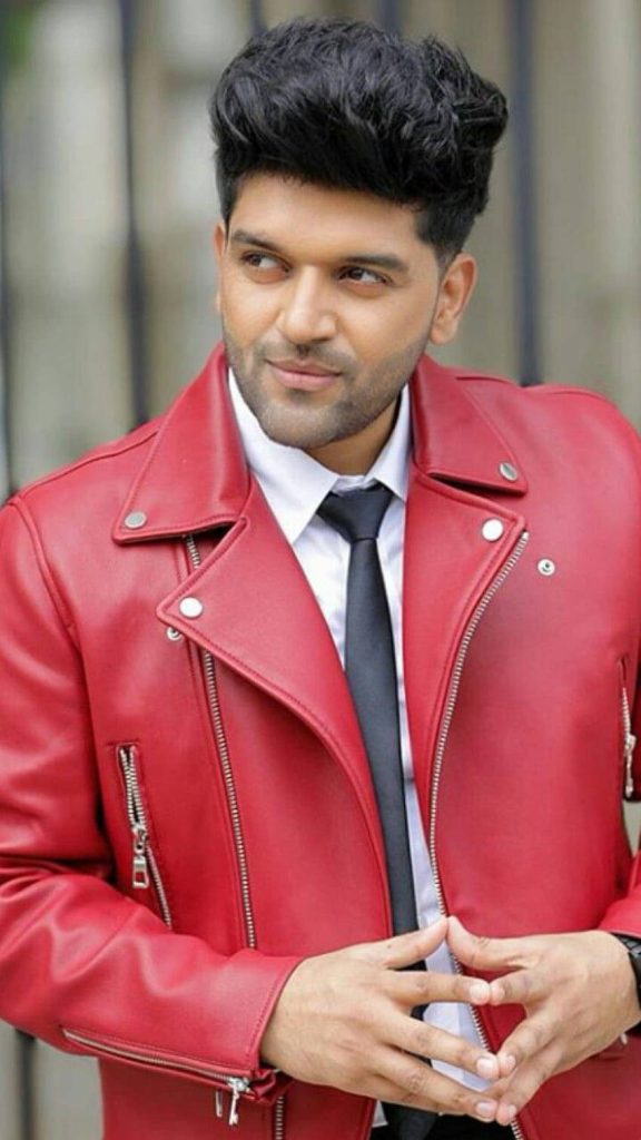 Guru Randhawa in red leather jacket white shirt black tie confident style music wallpaper