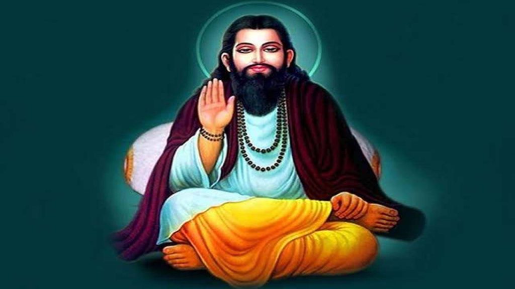 Guru Ravidas meditating in traditional attire with beads and raised blessing hand on teal background Wallpaper