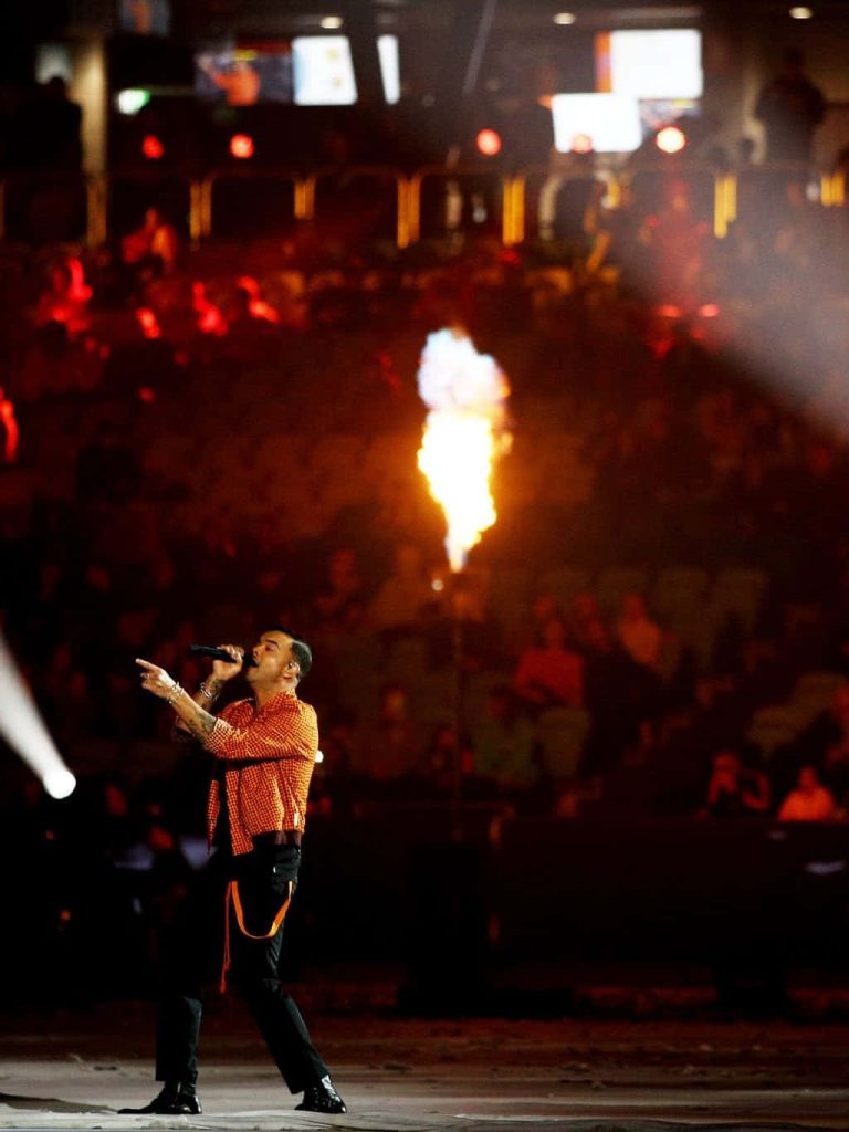 Guy Sebastian live performance wallpaper with fiery pyrotechnics and vibrant concert lighting