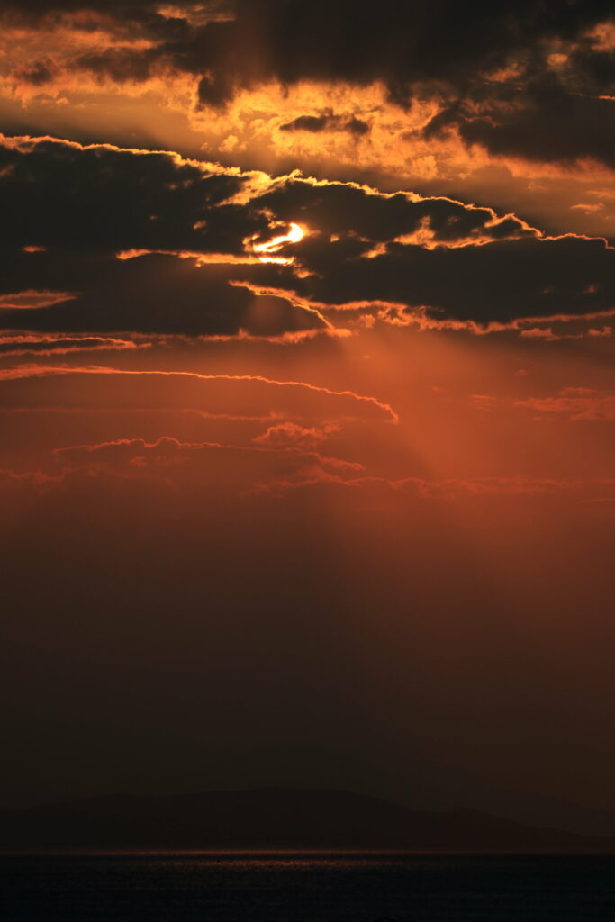 Dramatic Sunset HD Wallpaper: Sunlit Clouds & Moody Sky Background