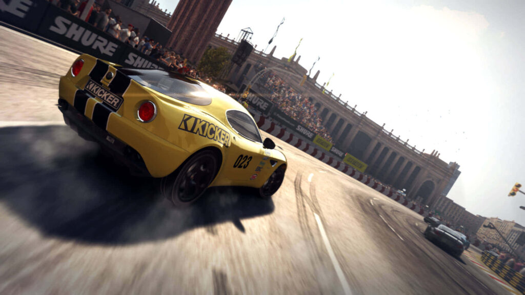 Intense Racing Moment: Yellow KICKER Sports Car Power Sliding in Grid Autosport Wallpaper