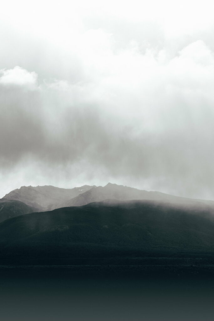 Serene Mountain Range Fog: Ethereal HD Phone Wallpaper Background