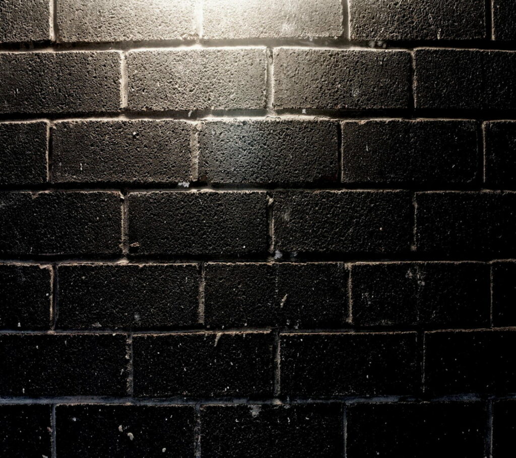 Beyond Boundaries: Captivating HD Wallpaper of a Striking Black Brick Wall